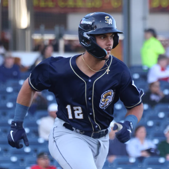Ethan Salas runs in a navy San Antonio Missions jersey