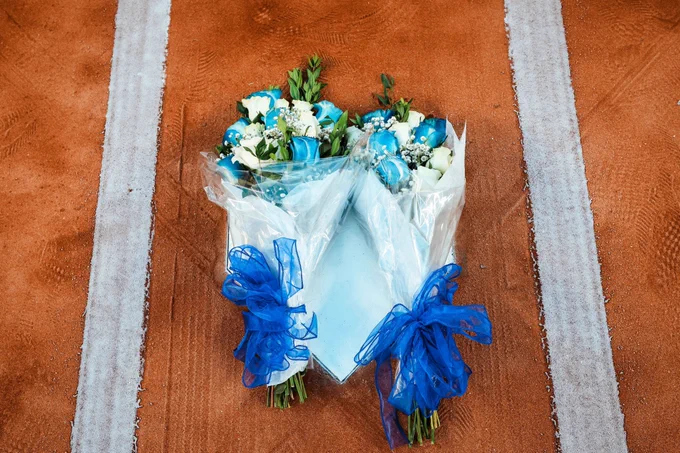 Suzyn Waldman and Michael Kay placed flowers on home plate during a pregame tribute to John Sterling. 