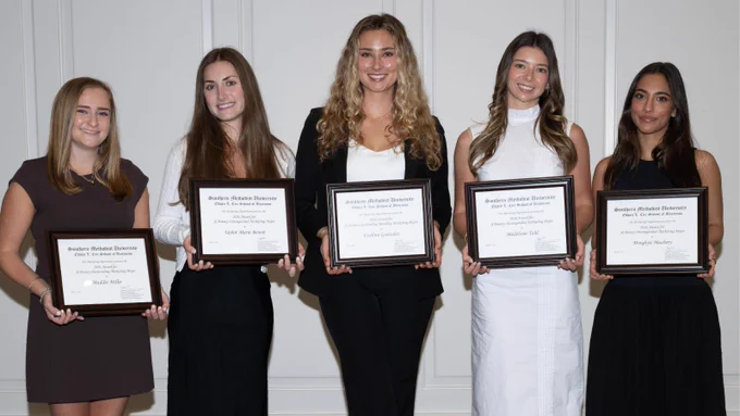 Five of the seven SMU Cox School of Business B.B.A. students honored by the marketing department for student excellence pose together, smiling and holding their awards.