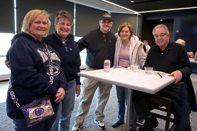 five Penn State fans around a table