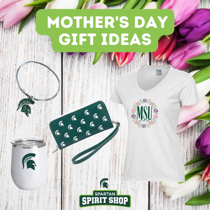 A collection of Mother's Day gift ideas featuring Michigan State University items: a bracelet, a green patterned wallet, a white T-shirt with "MSU" surrounded by a floral design, and a white tumbler with a Spartan logo. The background shows vibrant tulips on a wooden surface, with the text "Mother's Day Gift Ideas" and "Spartan Spirit Shop" displayed.