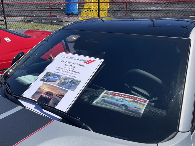Sunday, May 3, 2026, Carteret County Speedway near Swansboro, NC. Rise of the River Moon 1st Annual Powwow & Car Show. Pictured is the infographics the owner made for his all electric 2024 Dodge Charger Daytona Scat Pack with Track Pack in Triple Nickel silver.