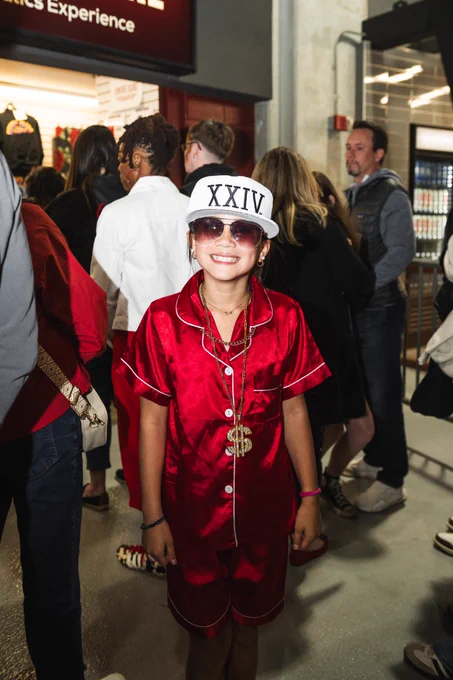 Photo of a young fan dressed up as Bruno Mars at the Romantic Tour.