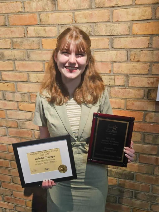 Isobelle smiling holder award and recognition