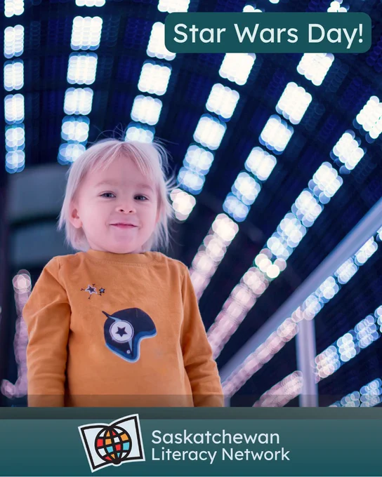 This picture is of a child standing in a space ship like tunnel. The caption reads 'Star Wars Day!' and the post is from the Saskatchewan Literacy Network. The Network logo is in the lower middle section and has a stylized book with a stylized globe in front of it, symbolizing the world of opportunities that are possible through literacy and learning. www.saskliteracy.ca  