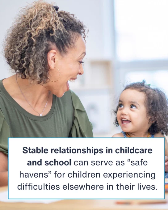 Teacher and young child smiling at each other. Text: Stable relationships in childcare and school can serve as “safe havens” for children experiencing difficulties elsewhere in their lives.
