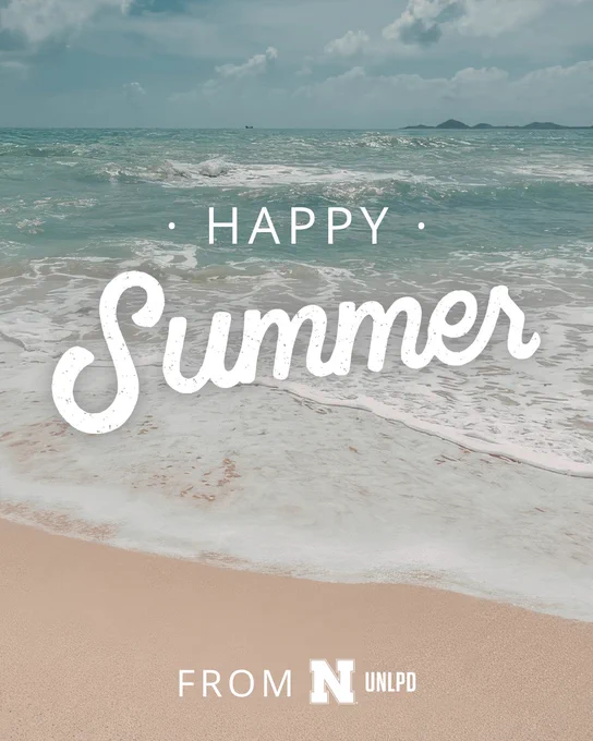 A beach scene with waves rolling onto the shore under a partly cloudy sky. White text over the image reads “Happy Summer,” with smaller text at the bottom saying “From UNLPD.”