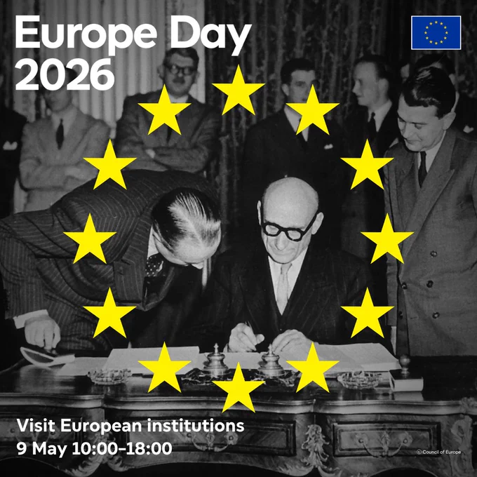 Black and white historical photo of a Robert Schuman signing a declaration with several people gathered around him. The image is overlaid with the European Union flag, yellow stars forming a circle around the photo, and text that reads 'Europe Day 2026.' Additional text states 'Visit European institutions 9 May 10:00–18:00' 