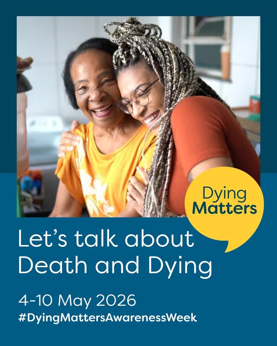 In a kitchen, two women engage in conversation about death and dying, with the words "let's talk about death and dying" displayed.

