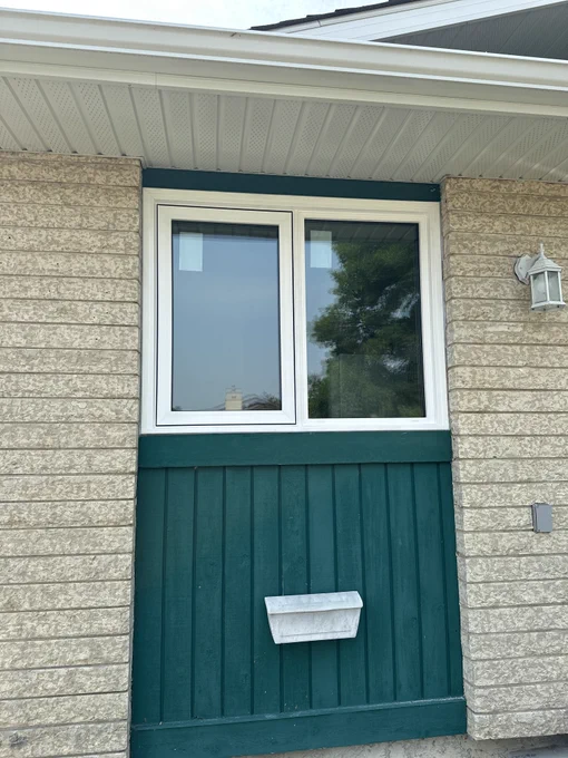 Close-up exterior view of a custom replacement window installed in a Winnipeg home highlighting a clean fit and energy-efficient window upgrade.