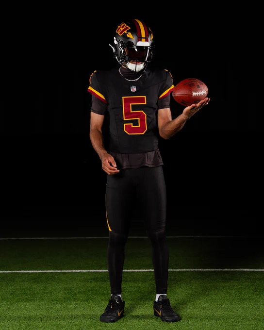 Photo of Jayden Daniels in our new black uniforms.