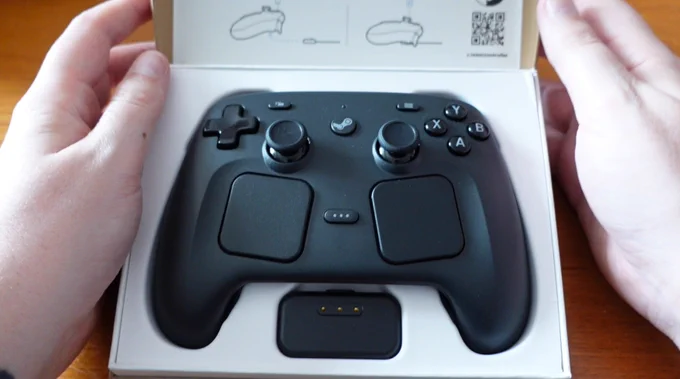 The opened box. The controller and sireless magnetic puck are initially visible.