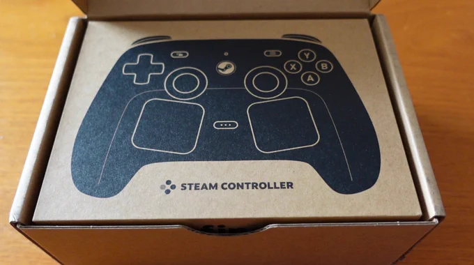 The Steam Controller outer box. Plain brown cardboard, with a black ink image of the controller front face.