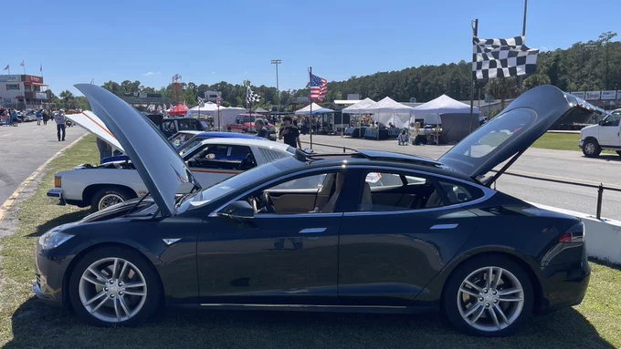 Sunday, May 3, 2026, Carteret County Speedway near Swansboro, NC.  Pictured is a Metallic Sequoia Green 2012 Model S, parked on the speedway’s infield.