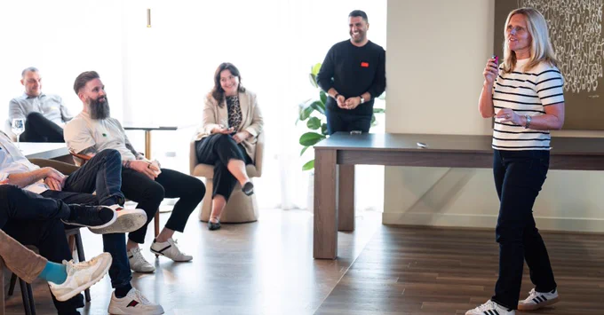 Speaker addressing a small group during a CP Digital launch discussion.