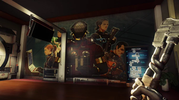 A screenshot from Prey: Mooncrash. The player is holding a wrench and looking at a large floor-to-ceiling mural featuring various characters wearing different coloured space suits, including red, grey, orange, blue and green. Next to the mural is a tall directory screen showing a map of the Pytheas moon base. The floor is polished wood.