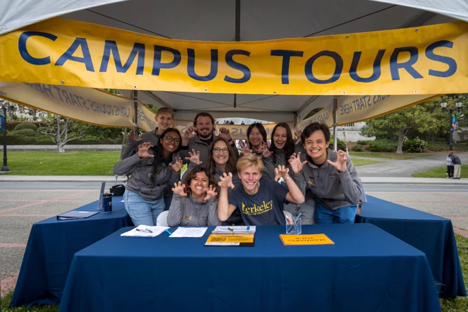 A group of tour guides for UC Berkeley posing for a photo.