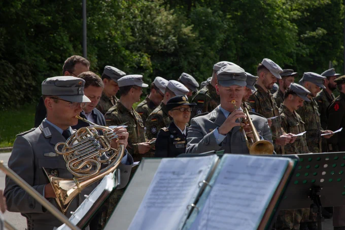 German Army band plays as U.S. and German Soldiers stand in formation during a Bad Reichenhall liberation commemoration ceremony.