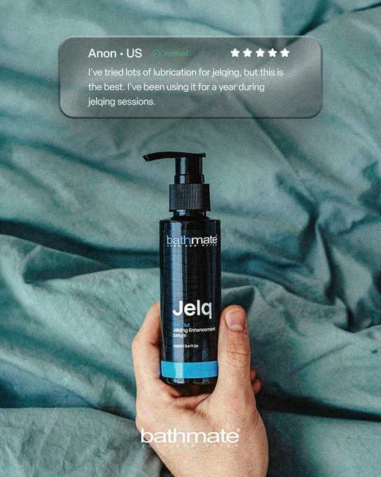 A hand holds a bottle of Bathmate Jelq Max Out Jelqing Enhancement Serum against a teal fabric background, with a text overlay displaying a customer review.