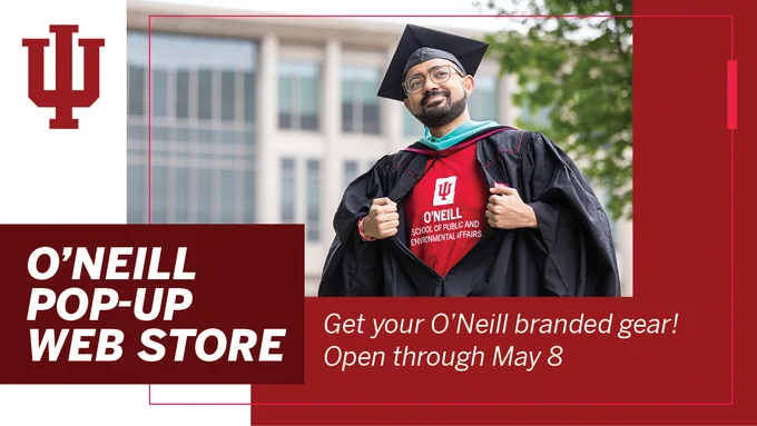 Graduate in cap and gown, opening it to reveal a red O’Neill T-shirt underneath, promoting the O’Neill Pop-up Web Store.