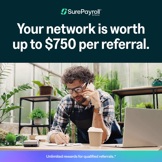 A person in an apron is seated at a desk with a laptop, speaking on a phone and taking notes. The background features plants and large windows. The text reads: "Your network is worth up to $750 per referral. Unlimited rewards for qualified referrals.*" The logo "SurePayroll by Paychex" is at the top.