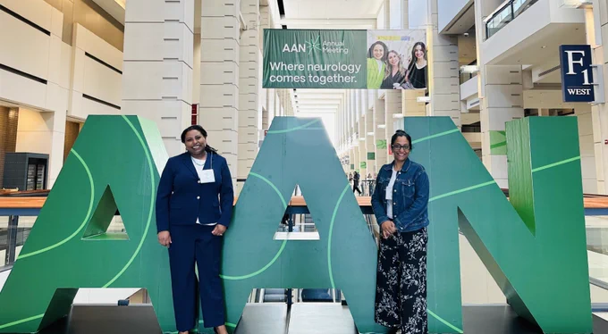  Ann Mathew, M.S.N., APRN, FNP-BC & Mimi Wodajo M.S.N., APRN, CCRN, AGACNP-BC, QIA with the AAN sign