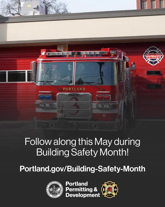 A firetruck sits in front of a red garage door at a Portland Fire & Rescue station. The text reads, "Follow along this May during Building Safety Month! Portland.gov/Building-Safety-Month"