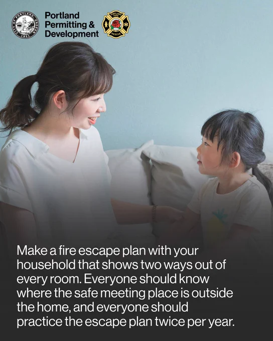 An Asian woman smiles at her daughter as they sit on a white couch and have a conversation in front of a light blue painted wall. The text reads, "Make a fire escape plan with your household that shows two ways out of every room. Everyone should know where the safe meeting place is outside the home, and everyone should practice the escape plan twice per year."