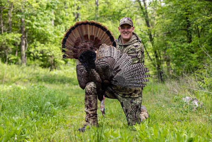 A hunter with a turkey.