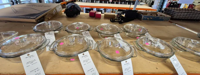 Various clear glass cookware on a shelf.