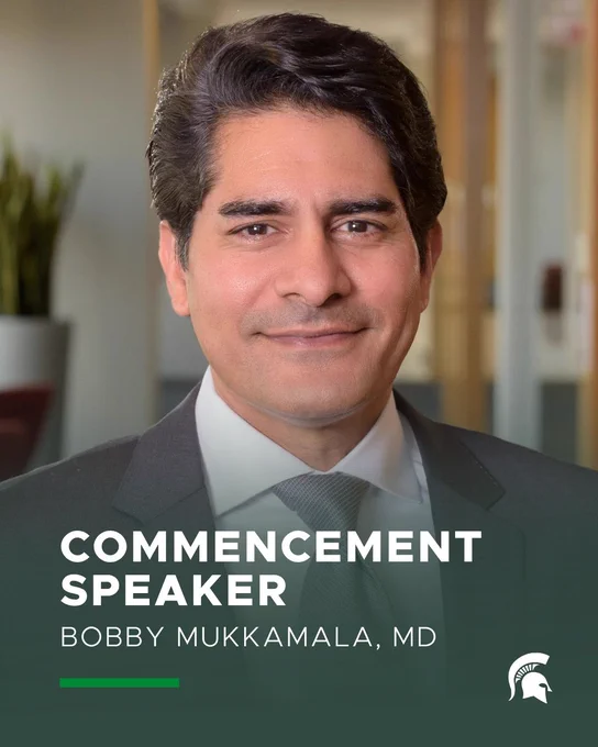 Headshot of Bobby Mukkamala, MD, wearing a suit and tie, centered against a softly blurred modern interior background with muted tones. He is looking directly at the camera with a neutral expression. Text overlay reads \u201CCommencement Speaker Bobby Mukkamala, MD,\u201D with a logo in the lower corner.