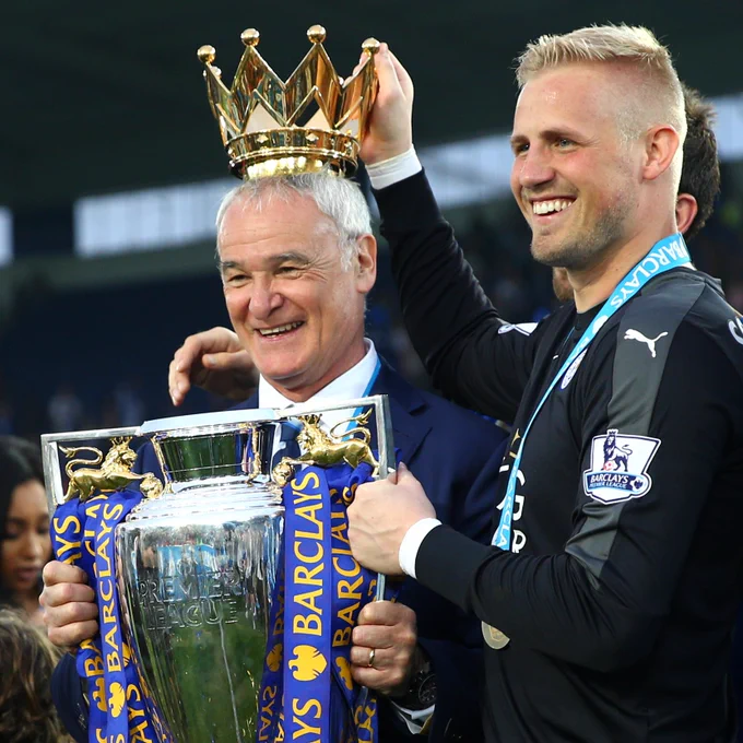 Claudio Ranieri and Kasper Schmeichel celebrate winning the Premier League.