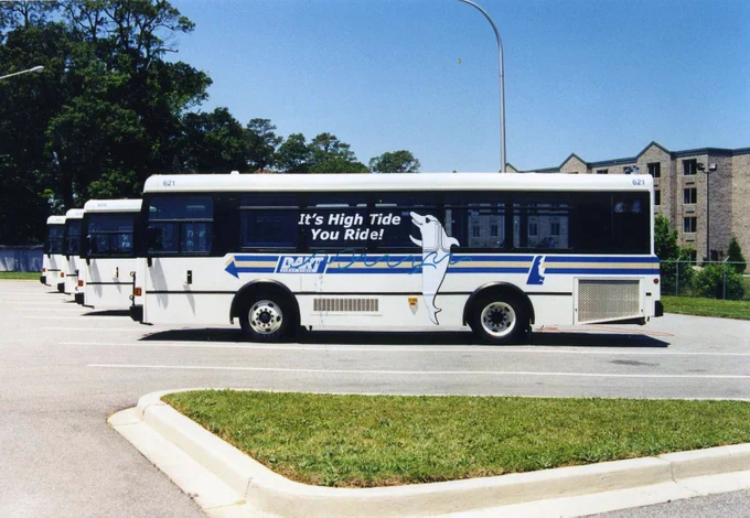 A fleet of DART buses with the previous DART Resort logo on it 