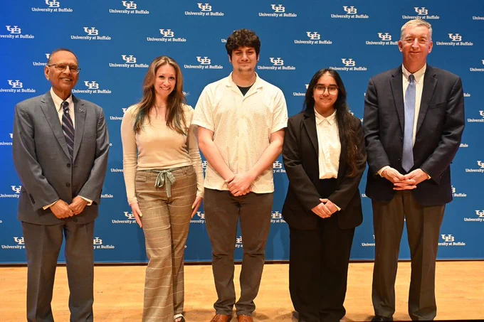 President Tripathi and Provost Weber pose for a picture with student scholars at the annual Celebration of Student Academic Excellence.