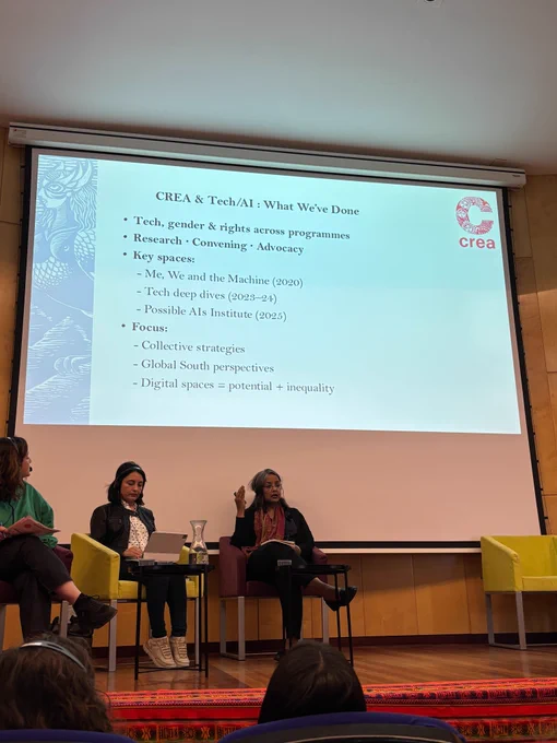 Panel discussion with three speakers seated on stage, wearing headsets, with a projected slide behind them, during a session titled “Misogyny and Algorithmic Discrimination: Meta’s Responsibilities in the Global South”; CREA’s Priya Das, Director – Programs and Innovation, is among the panelists.