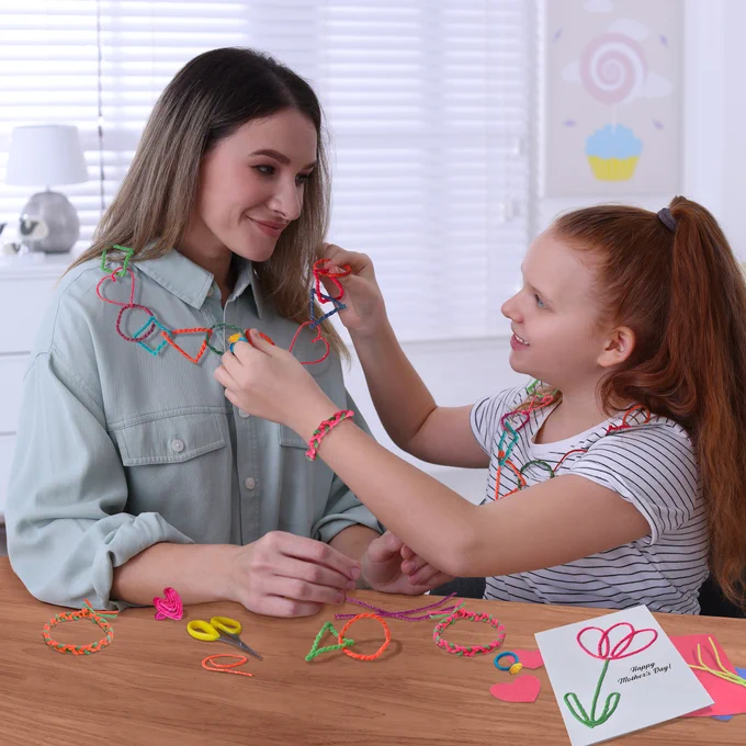 Mom and daughter creating Wikki Stix jewelry for Mother's Day!
