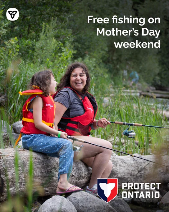 Text: Free fishing on Mother’s Day weekend 
A mother and daughter fishing while sitting on a fallen log.
