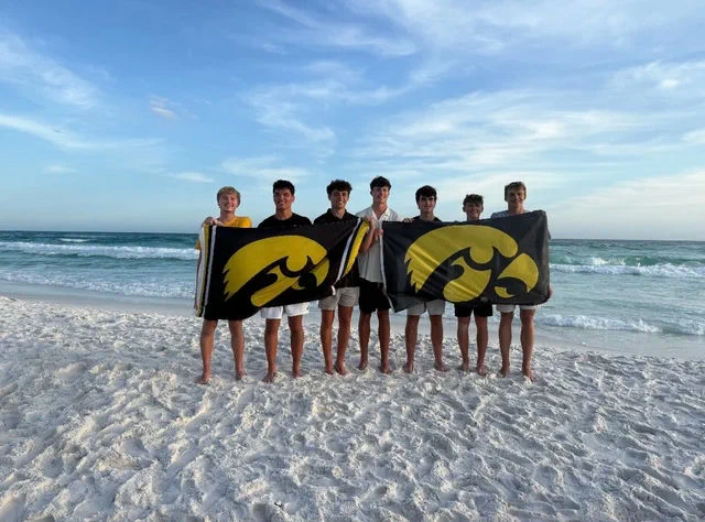 Future Hawkeyes holding up Iowa flags. 
