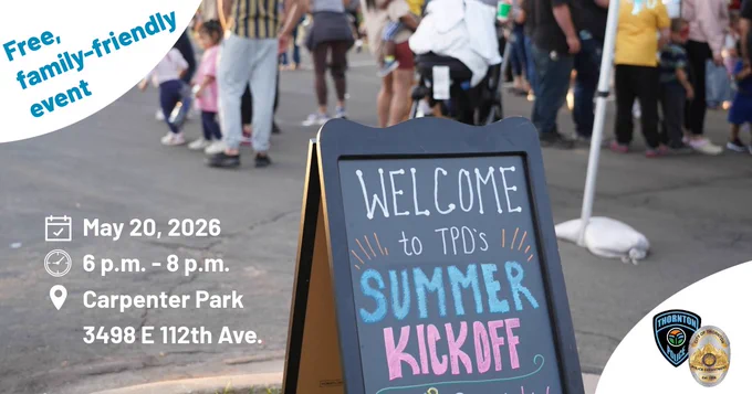 Summer kickoff sign with people in the background