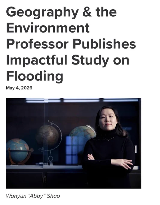 Wanyun "Abby" Shao, an AWI faculty fellow and CIROH researcher, standing in front of a table with globes wearing black against a dark background.