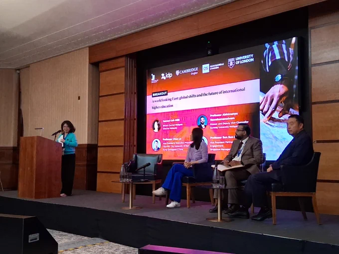 Four people in a panel discussion.