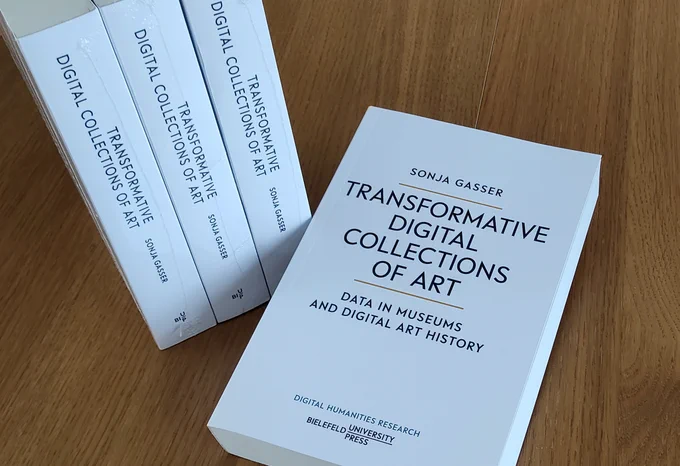 A photograph of the cover of the monograph: Sonja Gasser. Transformative Digital Collections of Art: Data in Museums and Digital Art History. Bielefeld University Press, 2025.