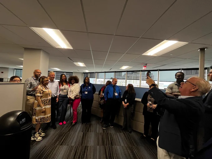 DRS Commissioner Mark Boughton takes a group photo of employees with Governor Ned Lamont inside DRS offices. 