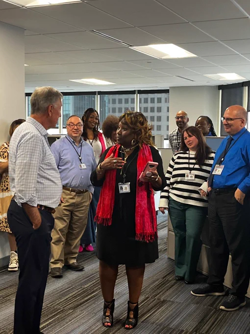 Governor Ned Lamont speaks with DRS employees during a visit to DRS offices. 