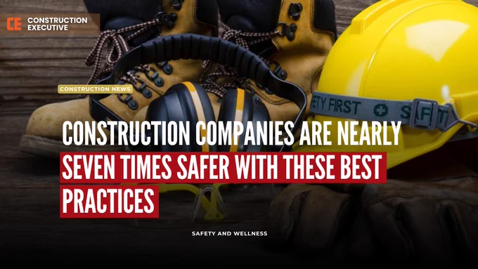 Construction safety helmet, safety gloves, work boots, safety glasses and ear protection on the ground.
