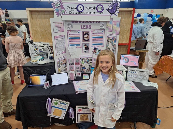 Students sharing their project with visitors