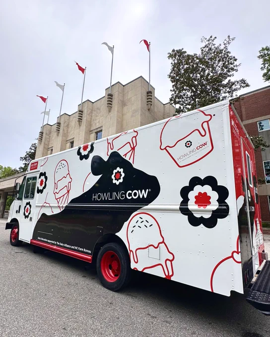 The NC State Howling Cow food truck in front of Reynolds Coliseum.