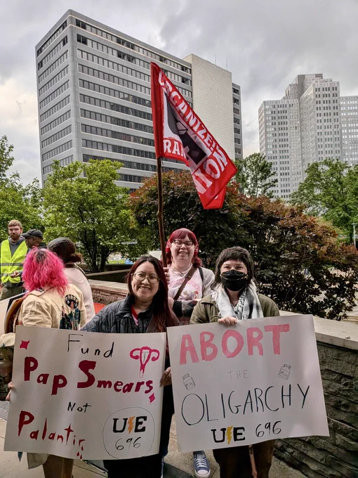 Members of Local 696 in Pittsburgh. They hold clever signs