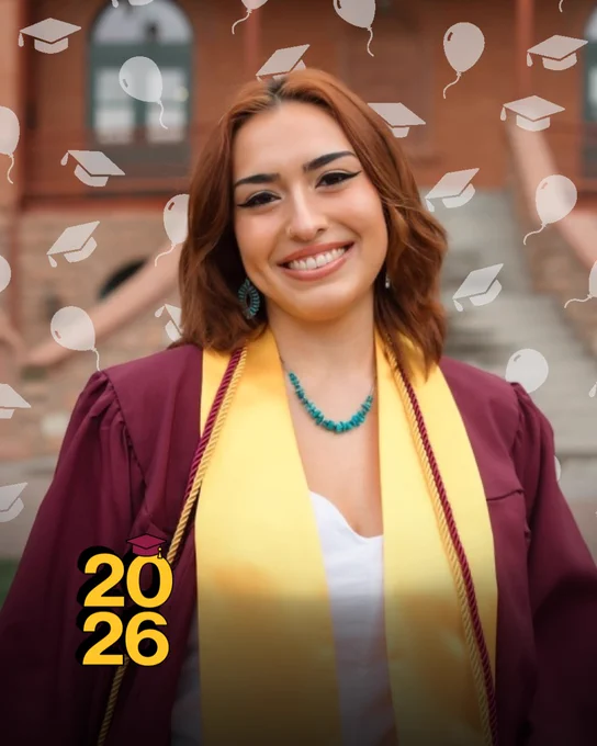 Lainey Tsosie in a maroon gown and gold stole, smiling, with "2026" and decorative caps and balloons in the background.