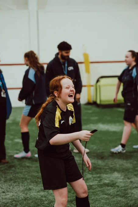 Girls play football at the Cliff Training Ground